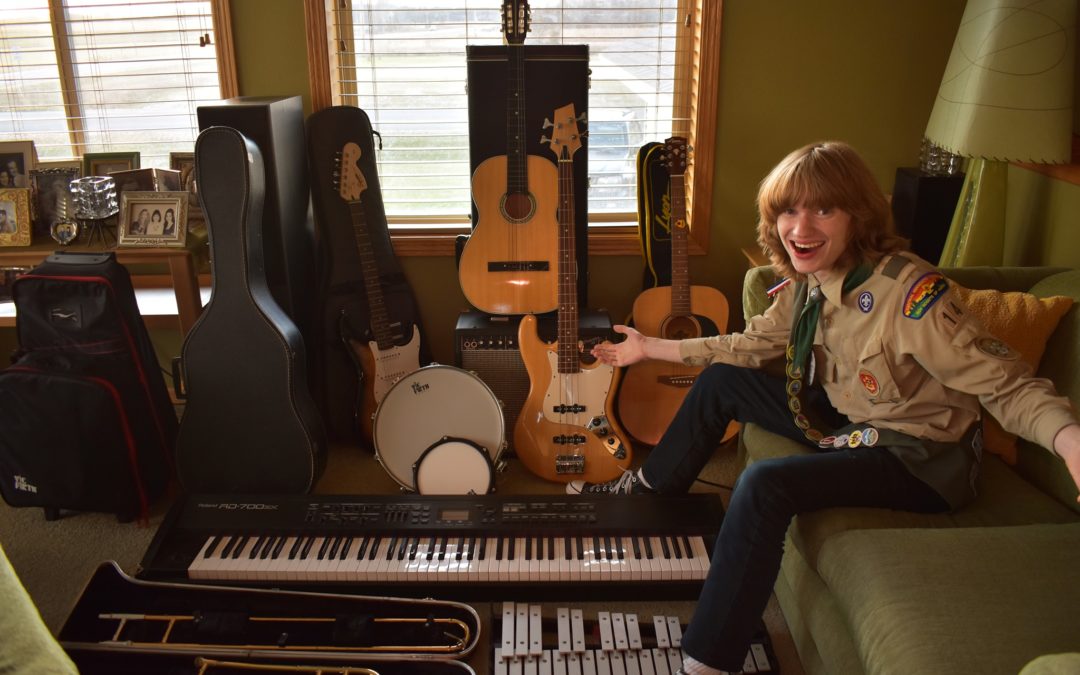 An eagle scout with all of their instruments.